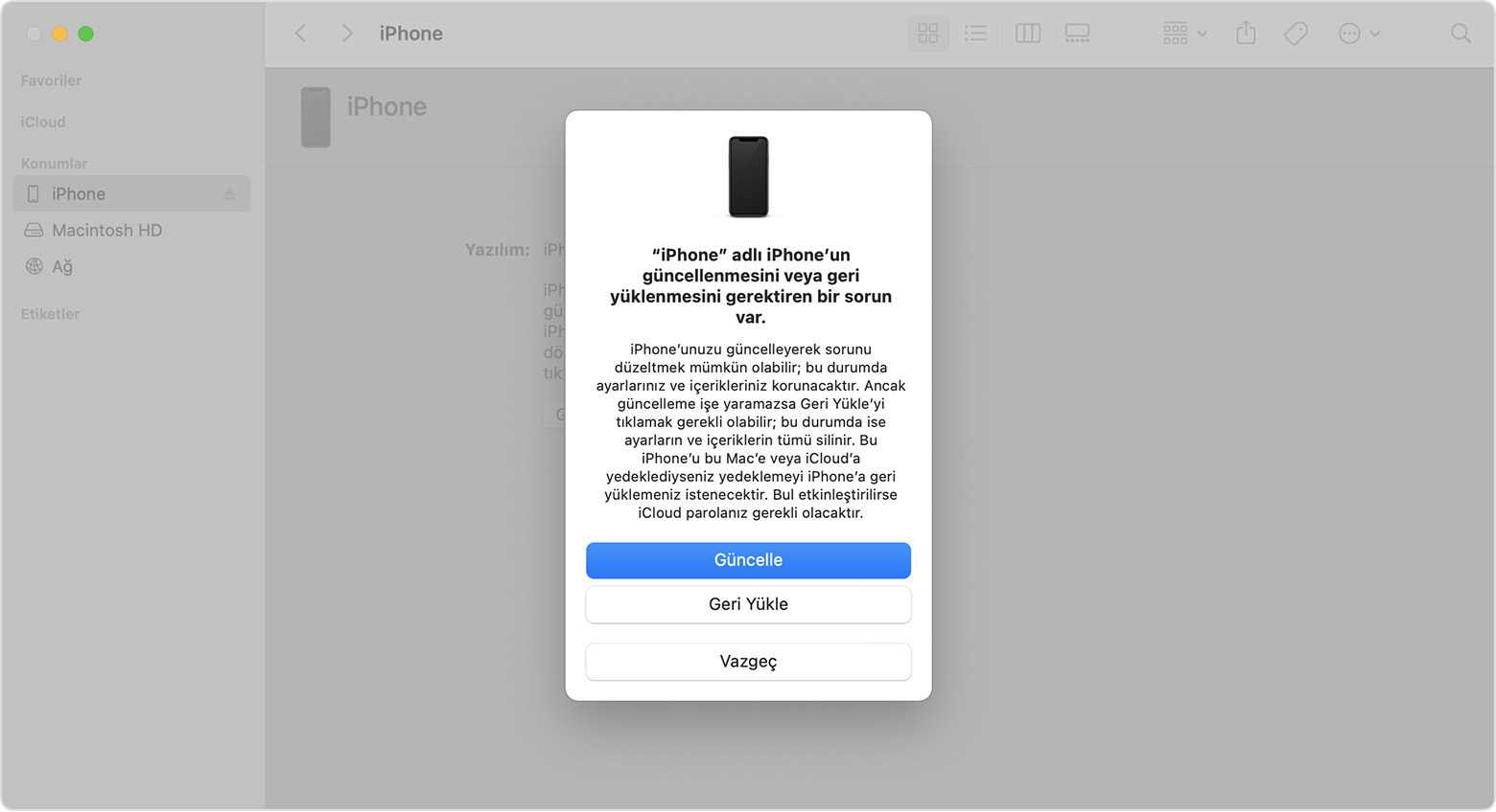 Mac'te iPhone'unuzu geri yükleme veya güncelleme seçeneklerini gösteren bir Finder penceresi