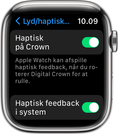 Apple Watch, der viser indstillingerne Haptisk på Crown og Haptisk feedback i system på skærmen Lyde og haptisk feedback i Indstillinger