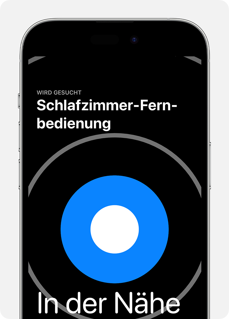 Auf dem iPhone-Display wird ein großer blauer Kreis mit dem Wort „nah“ angezeigt