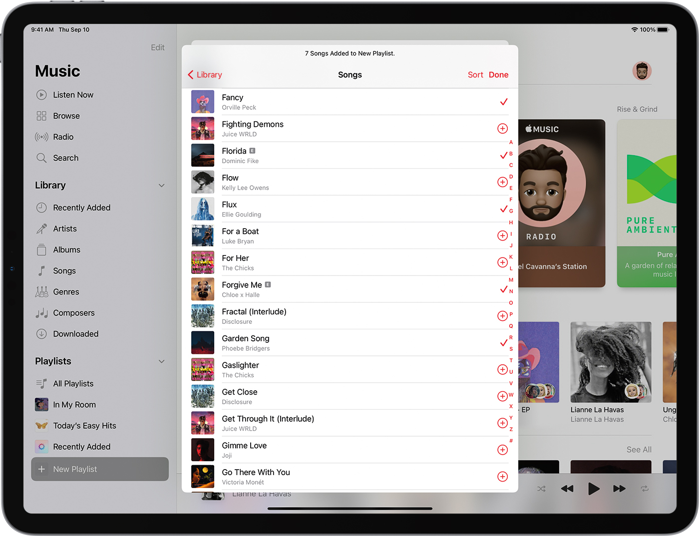 The iPad is showing 7 songs added to a new playlist