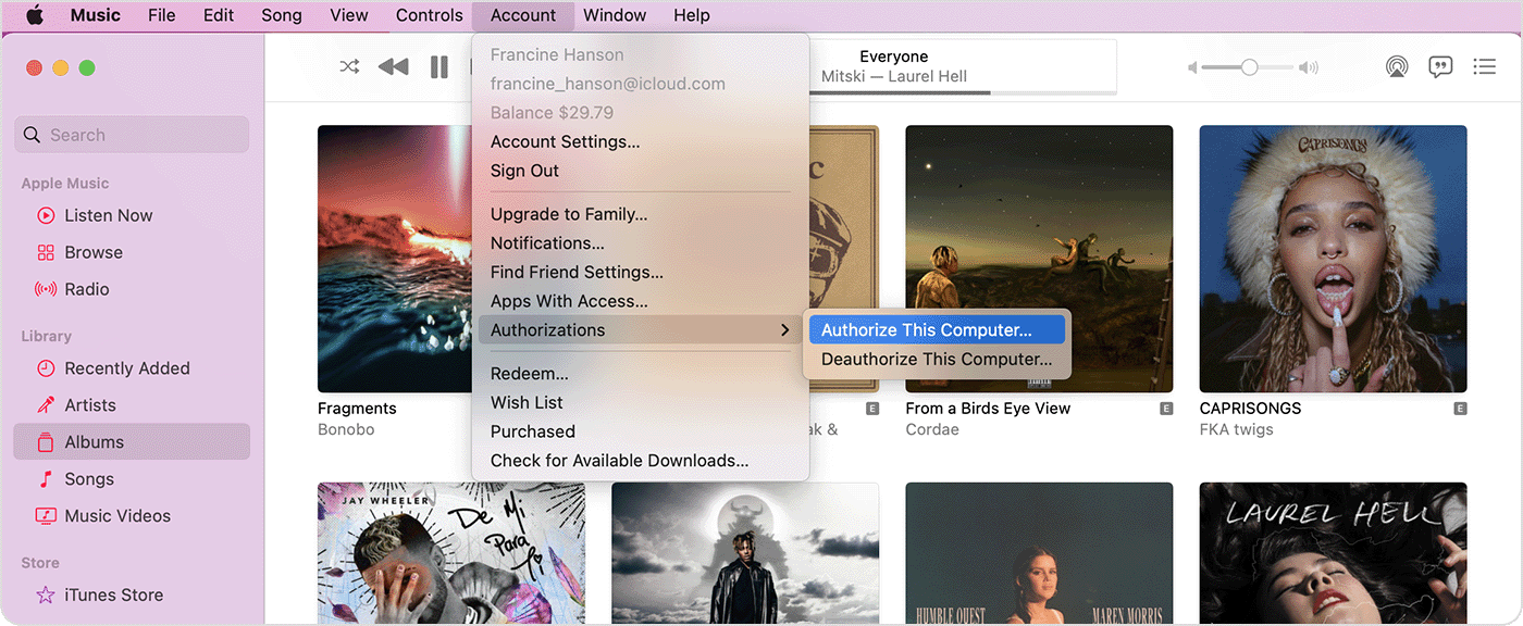 Apple Music app showing the Account menu, Authorizations, and Authorize This Computer. 