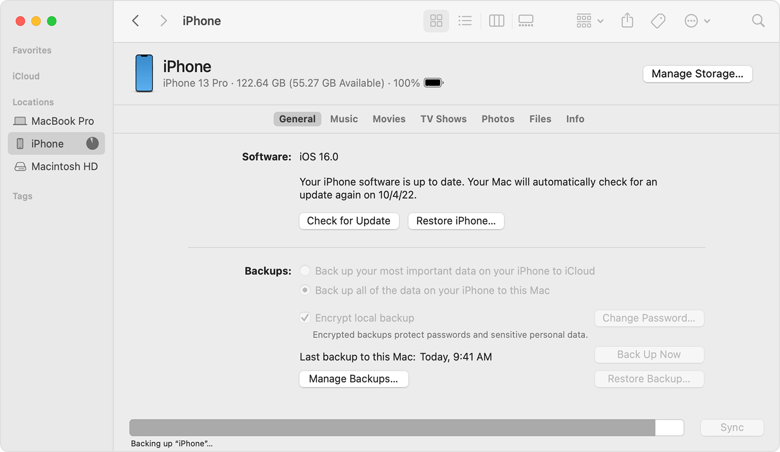 A Finder window showing an iPhone backup in progress.
