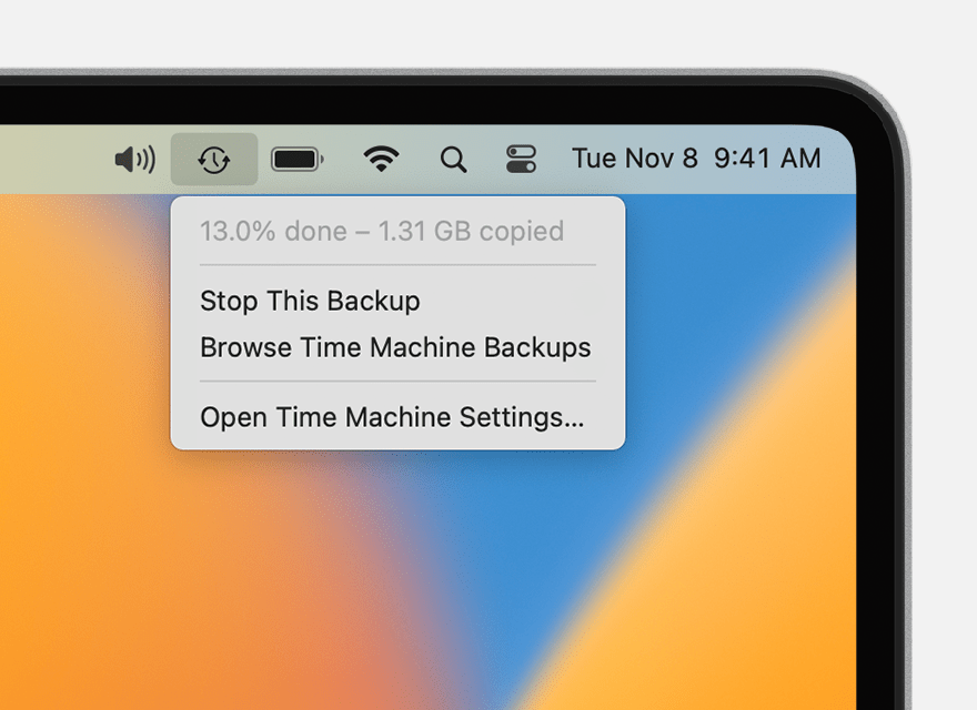 Time Machine menu showing a backup in progress