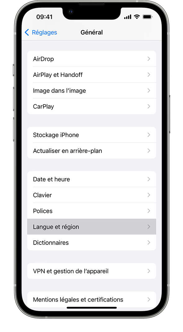 Un iPhone affichant le menu de réglages Général, avec l’option Langue et région en surbrillance.