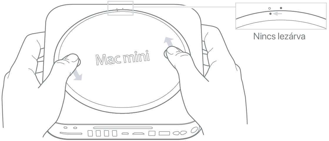 Két kéz a Mac mini alsó fedőlapját forgatja el
