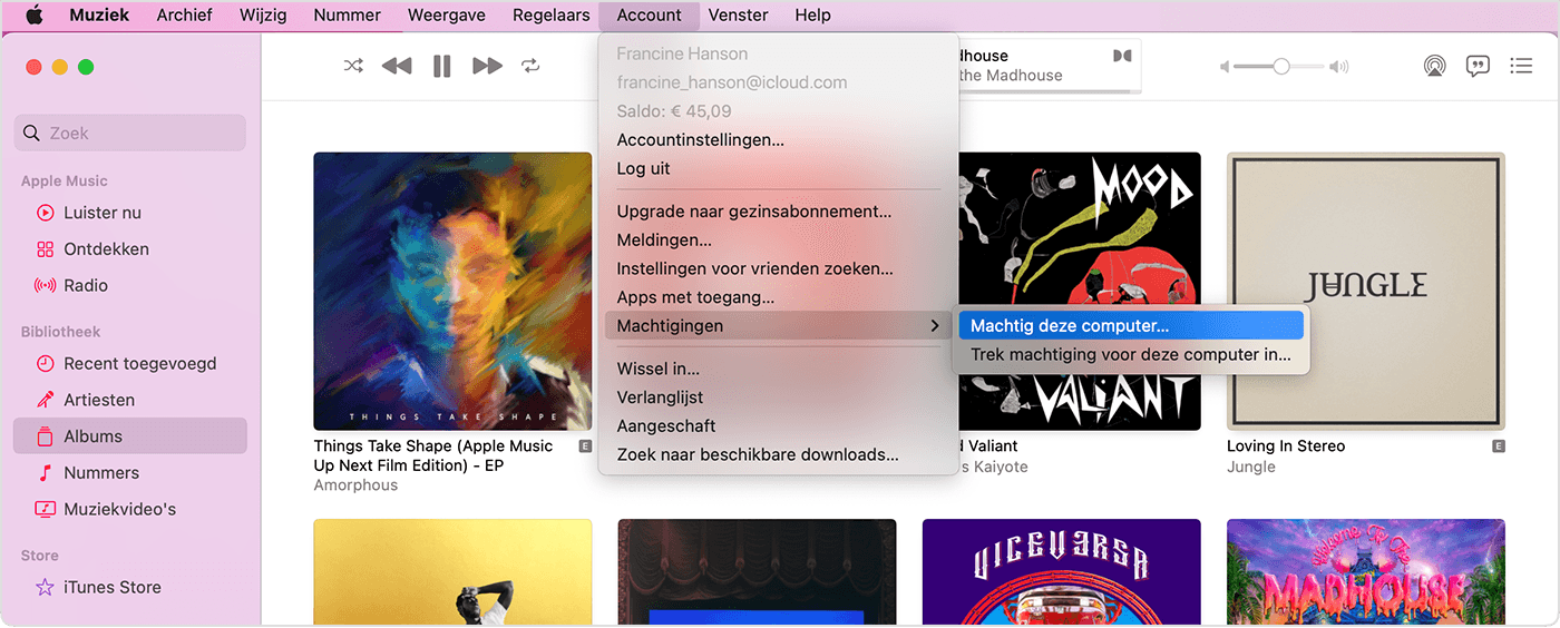 Apple Music-app met het menu 'Account', 'Machtigingen' en 'Machtig deze computer'. 