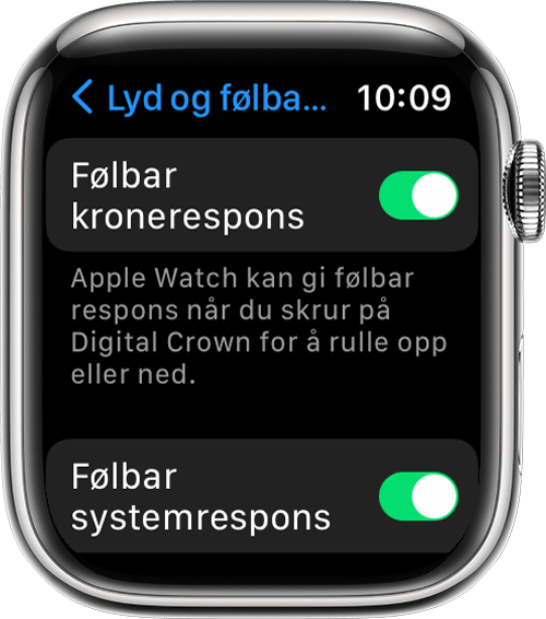 Apple Watch som viser innstillingene for Følbar kronerespons og Følbar systemrespons på Lyder og følbar respons-skjermen i Innstillinger