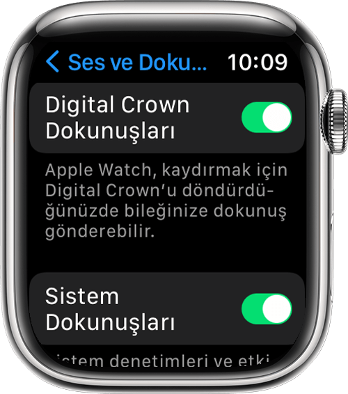 Ayarlar'daki Ses ve Dokunuş ekranında Crown Dokunuşları'nı ve Sistem Dokunuşları'nı gösteren Apple Watch