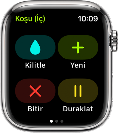 Apple Watch'taki Koşu (İç) antrenmanı sırasında Kilitle, Yeni, Bitir ve Duraklat seçenekleri.